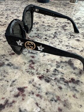 Gucci Black Sunglasses with Gold Logo and Crystal Star Accents